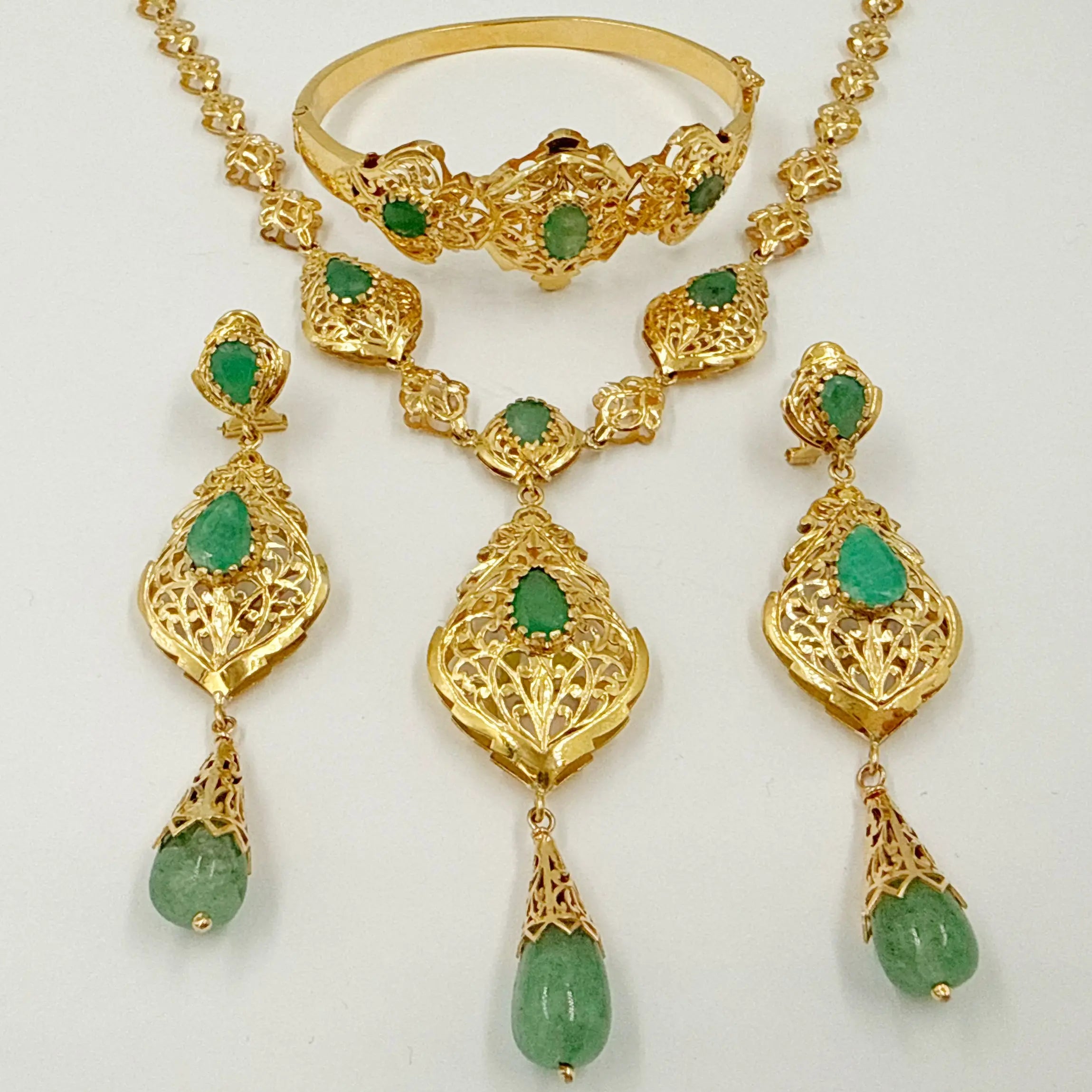 Bijoux Tekhram en or rose avec pierres vertes