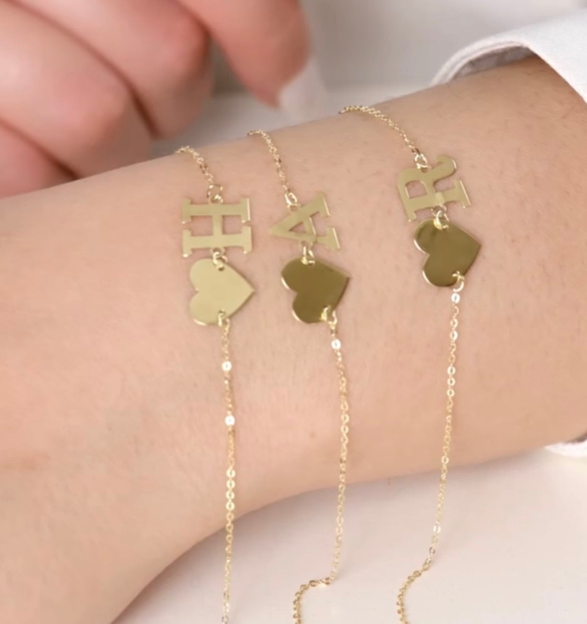 Gourmette coeur lettre en or18k