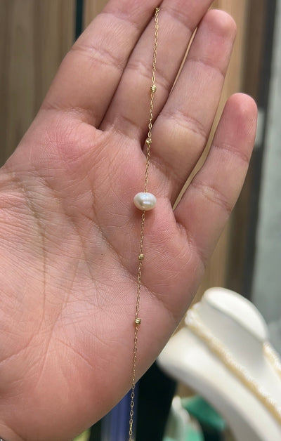 Gourmette en Or18k avec une perle naturelle